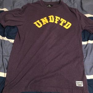 Undefeated T-shirt Gold letters Purple UNDFTD